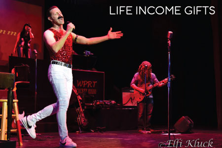 Life Income Gift featuring a scene from the 2020 Rockin' Legends New Year Concert with Travis Poelle as Freddie Mercury