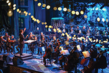 Pictured Montery Symphony performing on the Outdoor Forest Theater stage.